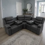 6 seater leather corner sofa recliner sofa in a bright sunroom with large windows, French doors, pale blue-grey walls, light flooring, potted plants, and natural daylight.
