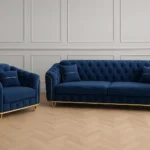 Side view of blue 3 plus 2 seater foam filled sofa set showing curved arms and steel leg construction