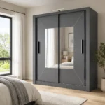 Dark grey wardrobe with two doors and three drawers placed in a small UK apartment bedroom with practical furniture and soft natural daylight.