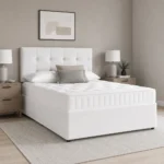 Divan bed white base frame and white mattress in bedroom