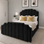 Black upholstered bed with panelled headboard